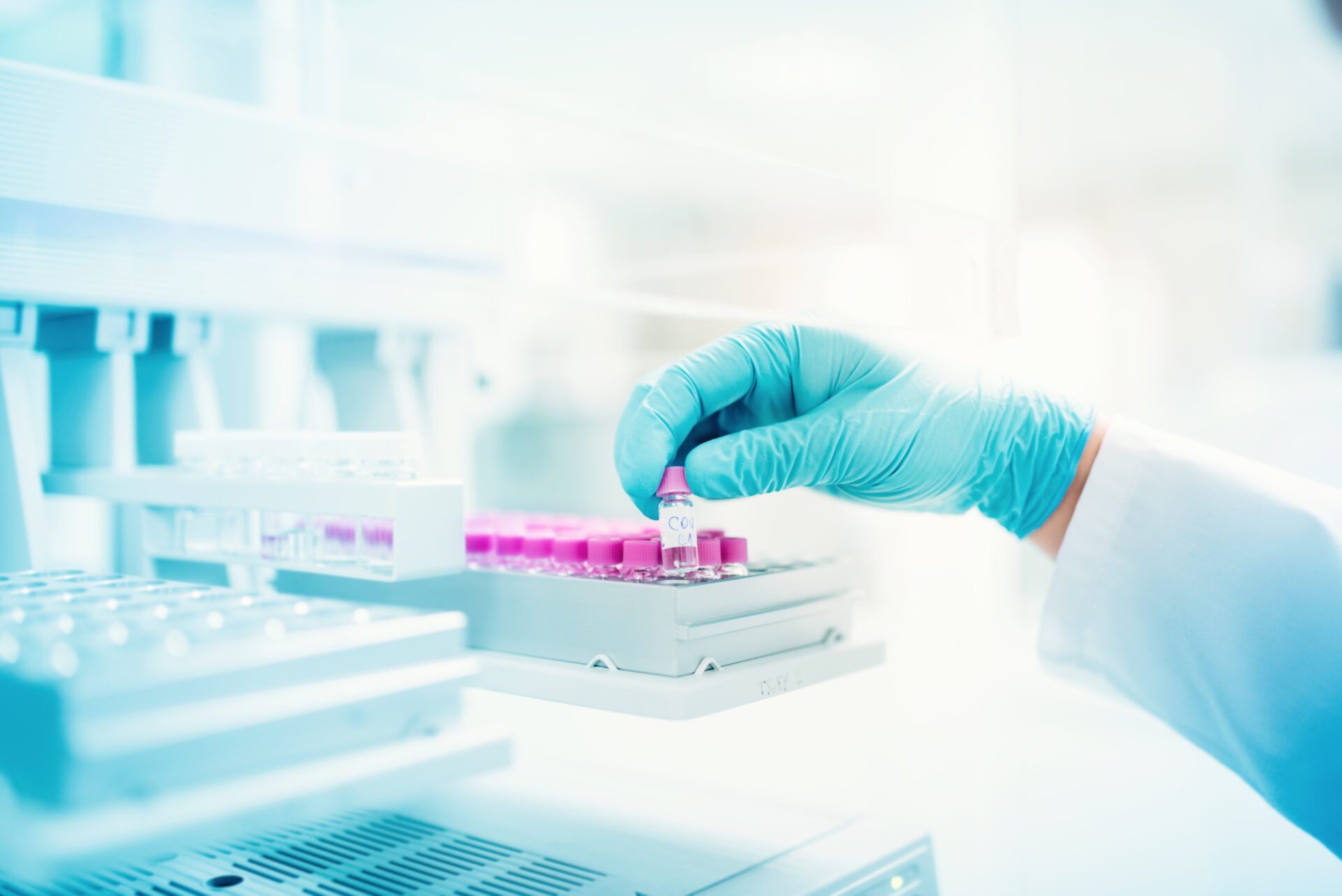 professional scientist holding sample of experiment in pharmaceutical environment. close up of medical details
